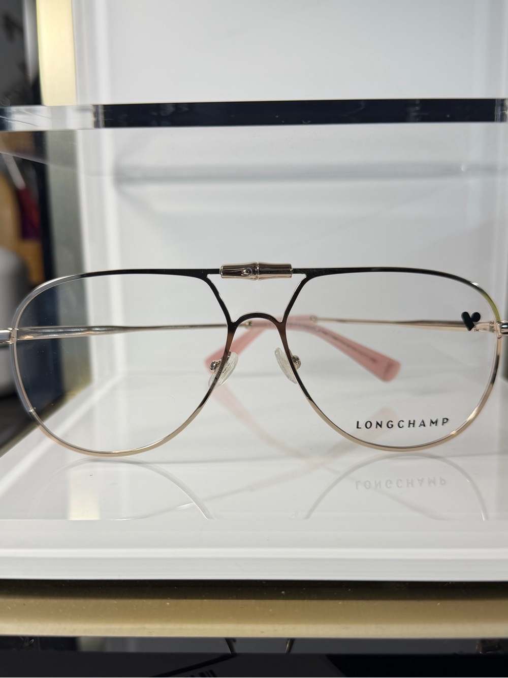 Longchamp Gold Frame Eyeglass Accent with Pink Temple Tips
